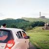 Joana, David and our pink Chevy in Buzludzha, Bulgaria. House-Monument of the Bulgarian Communist Party. analog: Cosina C1s.